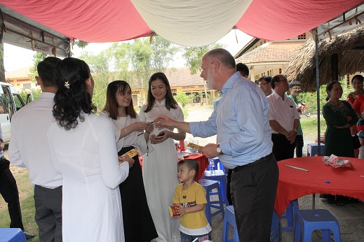 Fr.Chris Chaplin giving lucky money