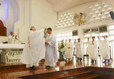 the blessing to Fr Andrew for his new mission